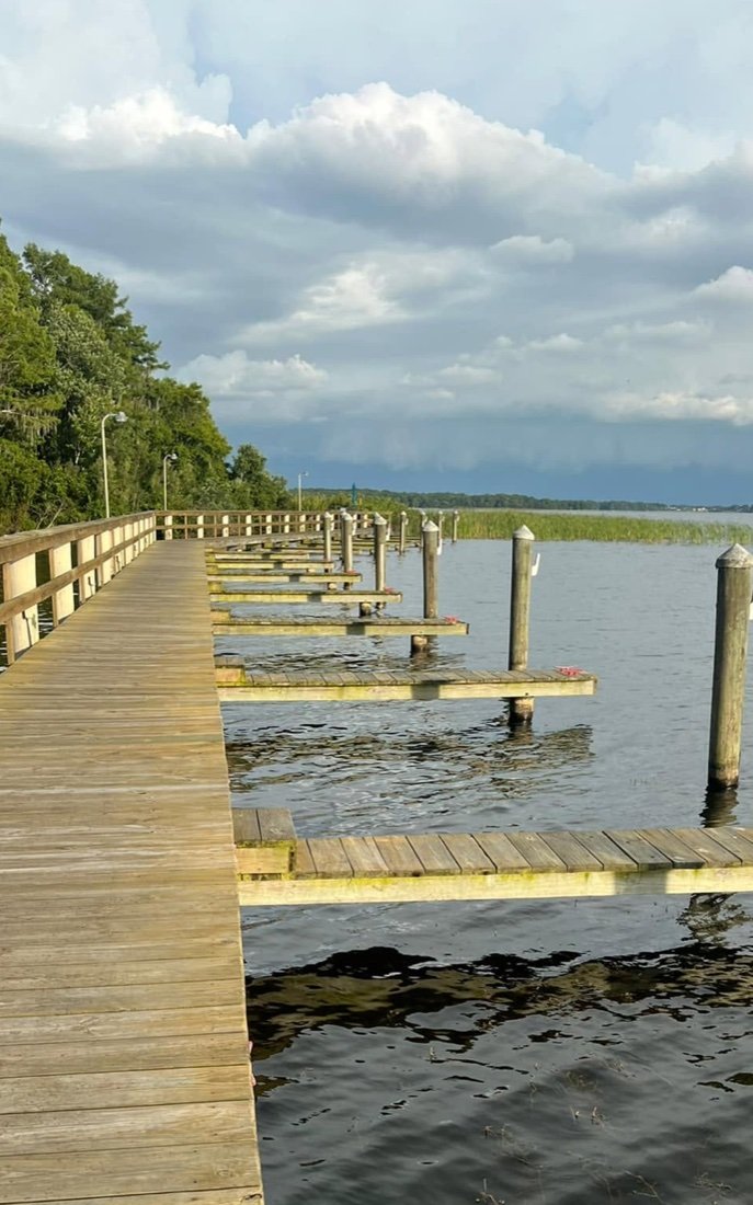 Weathered gray boardwalk before cleaning